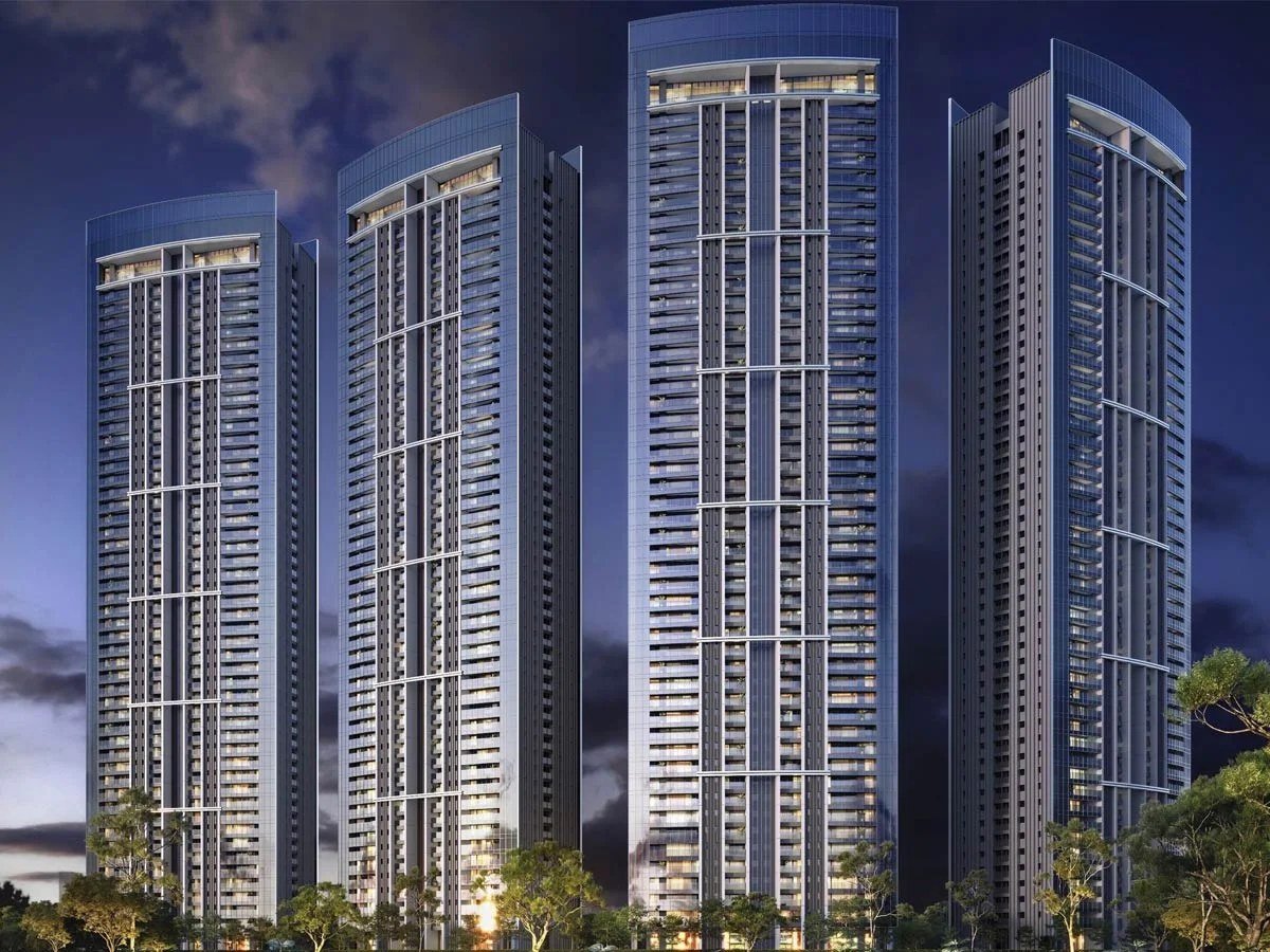 DLF Privana North residential towers illuminated at night